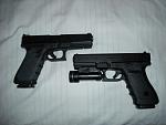 trusty glock 22 left and brand new 21c right