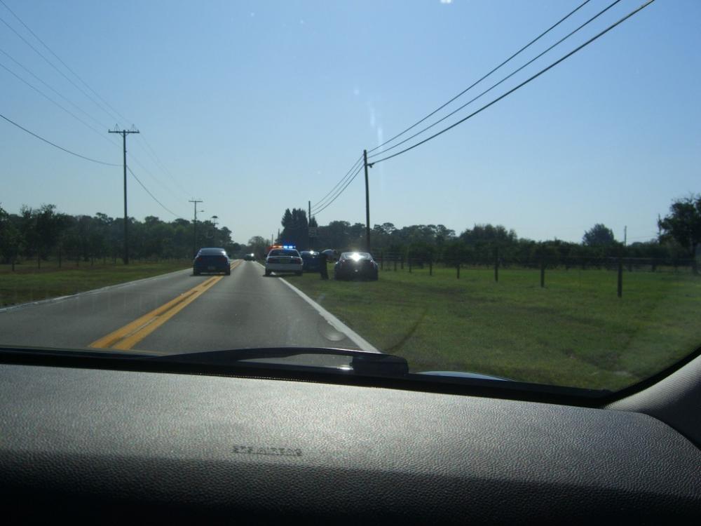 Within the first 30 minutes of a Poker Run, a group of 4 of us got pulled over. Only the lead car got a ticket...luckily I just got a warning. A friend caught a shot of it.