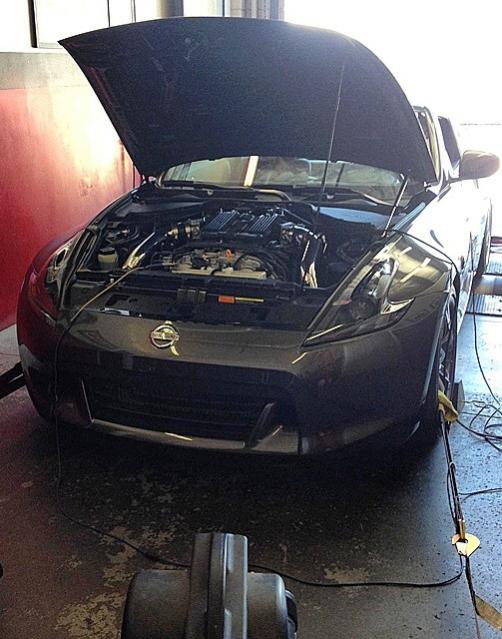 Car on the dyno at Specialty Z for Fast Intentions twin turbo tune.