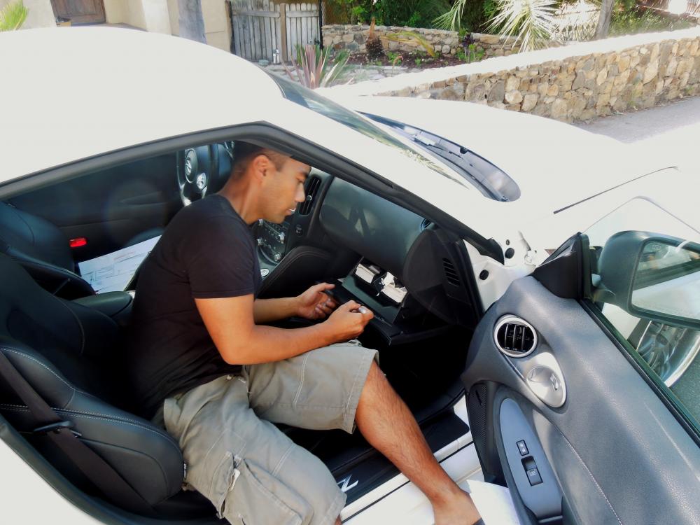 This is a mod.  The designer of the 370 Z, Randy Rodriguez signing my car at his residence on May 25, 2013.