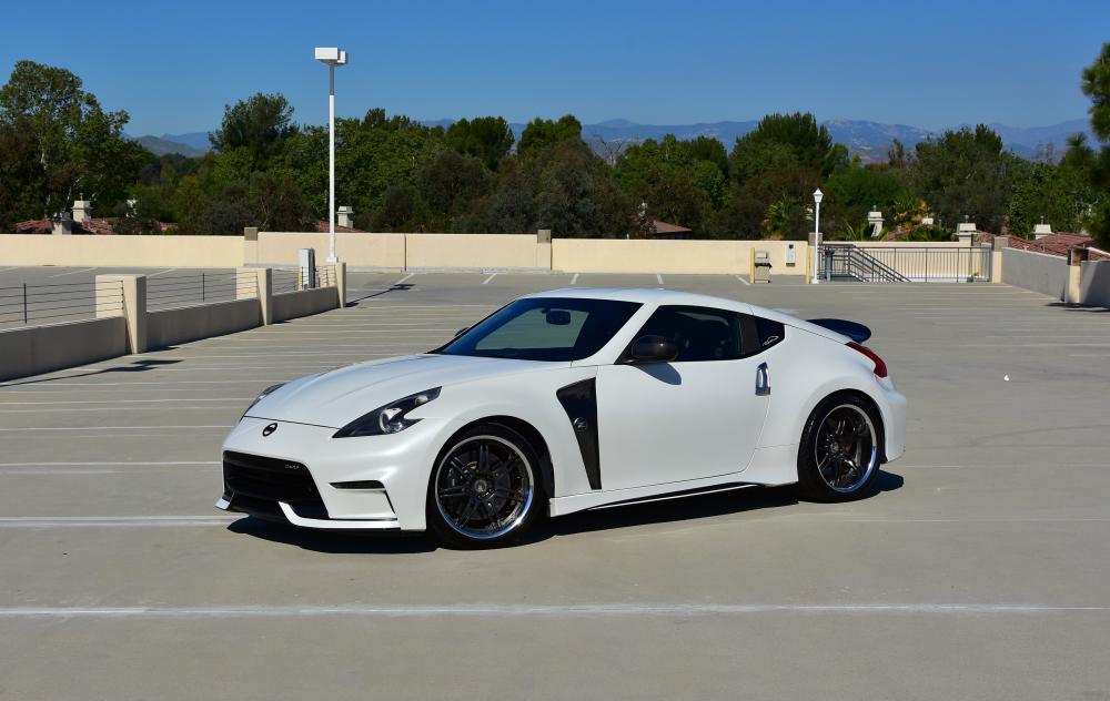 Finally completed the mod.  Moved on from the Sunline rep from AeroJacket onto the 2015+ Nismo kit.  No red accents on the kit and went with a black and white finish instead.  Picked up black emblems as well. Kept the fenders and the spoiler.