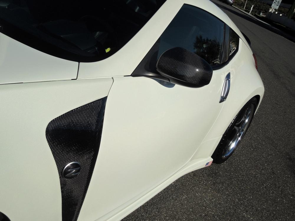 CF treatments.  
Fenders, mirror cap, B pillar, ducktail, and diffuser.  And if you look underneath, CF muffler.