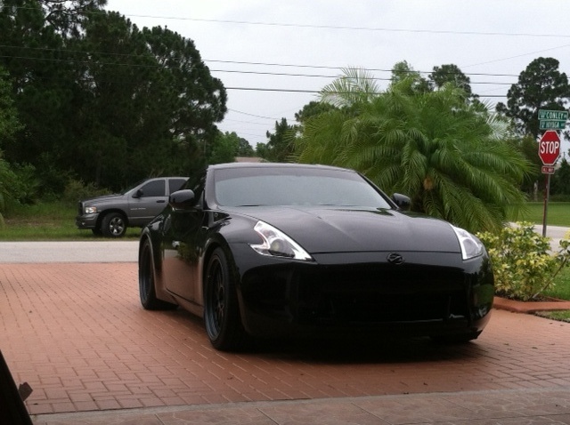 Front view of car in driveway . . .completely blacked out (minus headlight shrouds, which are coming soon)