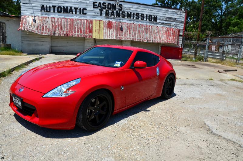 Red 370z with flat black Varrstoen wheels.