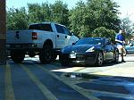 Washing my car next to a huge truck