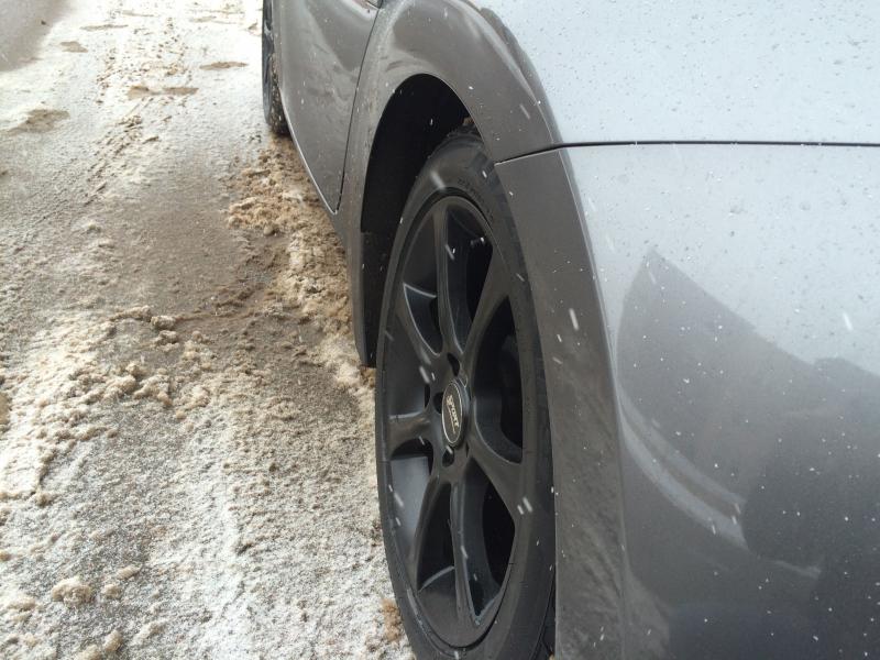 Rear view of snow tire; note it being sunken in.