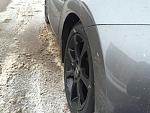 Rear view of snow tire; note it being sunken in.