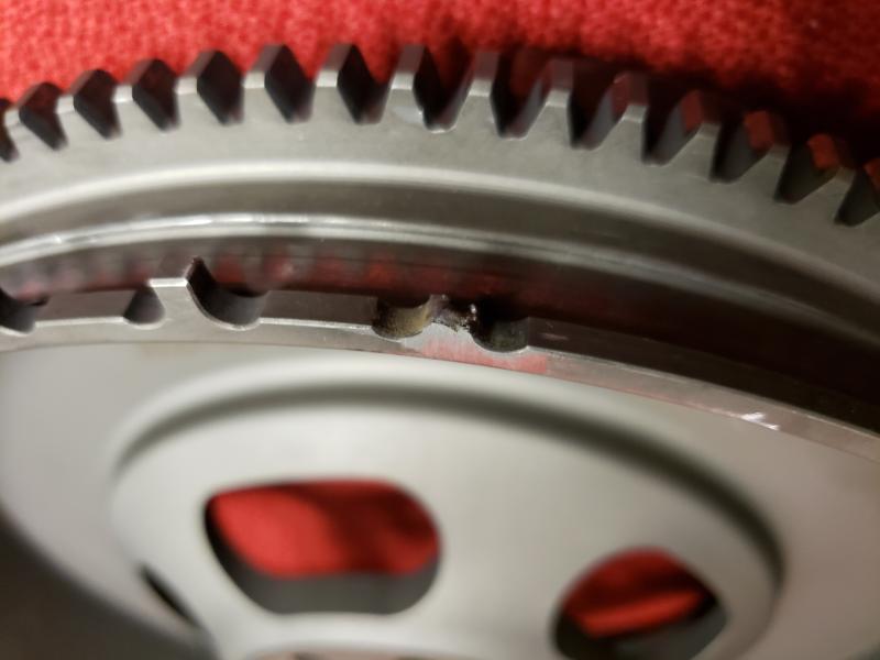 Close-up detail of the broken tooth on the lightweight flywheel.  The abrasion is from JoTech prepping the tooth to be welded. Z1 Motorsports adevised this cannot be fixed via a weld.  New flywheel wass needed.  This missing tooth caused the P0335 code.