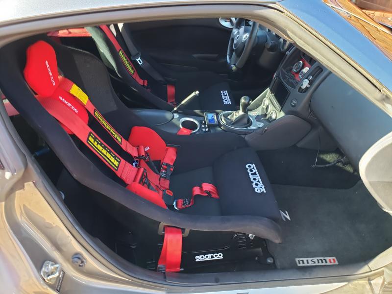 The new Sparco seat in place in the 370.  With the seat slider it is just a bit higher in the car.  Sitting in it I am just touching the ceiling but the passengers are not all 6'3" tall like I am.  No problem on the drivers side.  Loads of headroom for the driver.