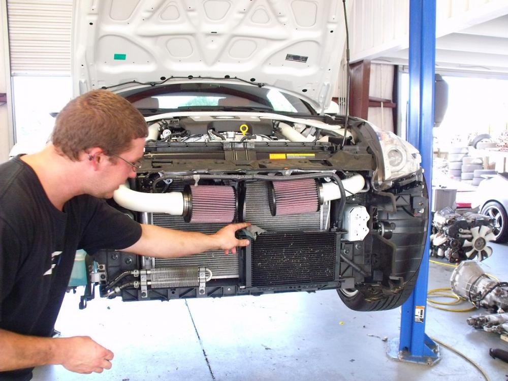 Spencer showing me where the Oil Cooler goes in my Gen III and oil cooler install day.