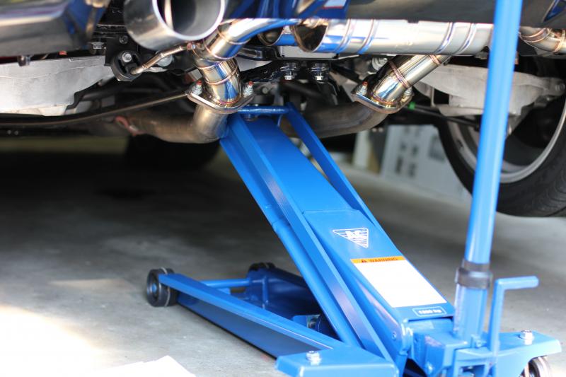 I got it up to 8" of clearance under each tire (suspension has droop too), but this picture is after I lowered it down a bit.  Also, the side exhaust hanger on the Nismo models is different than the stock one.  I should just remove it.