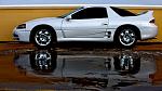 Parked next to a wall on the top level of a parking garage. melted snow is the foreground. I didnt even think about getting a reflection in the shot,...