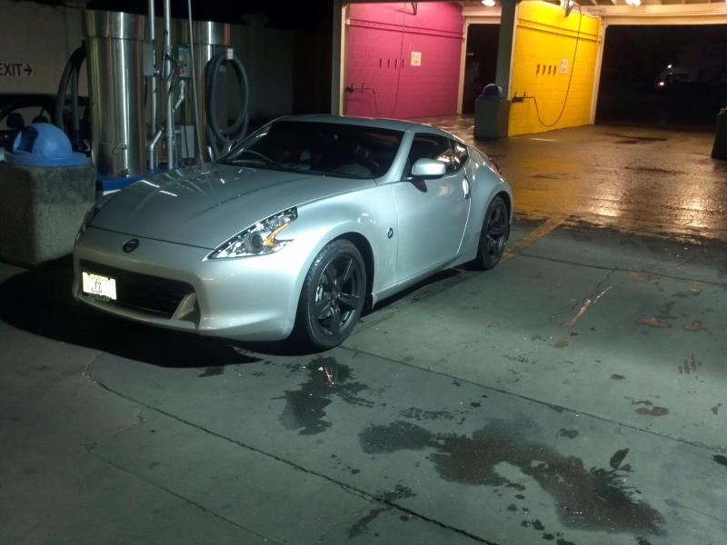 2011 370z Touring with plasti-dipped emblems and 18inch rims.