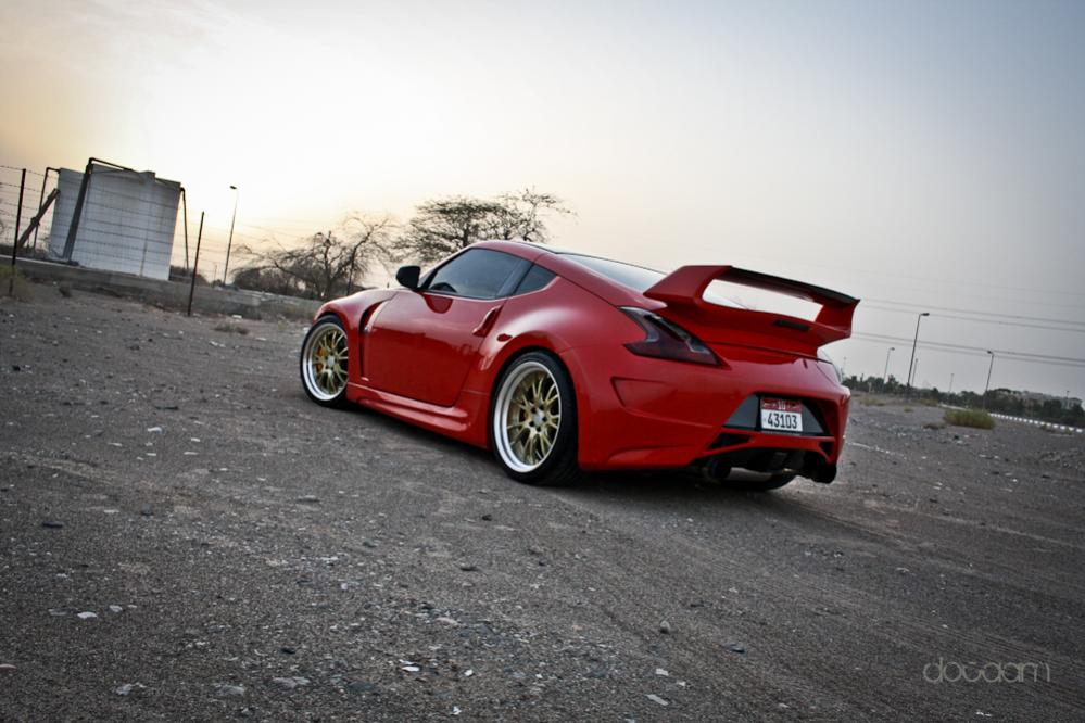 Work Gnosis, sunline CF roof cap and resprayed in Ferrari Red