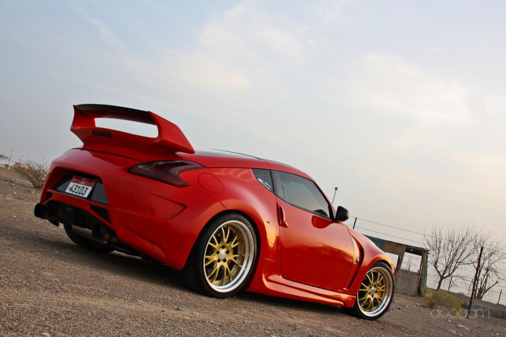 Work Gnosis, sunline CF roof cap and resprayed in Ferrari Red