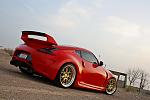 Work Gnosis, sunline CF roof cap and resprayed in Ferrari Red