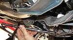 To take off the rearmost bolts, use an open end 17mm wrench to hold the nut at the top, and use a torque bar to loosen the bolt head from below.