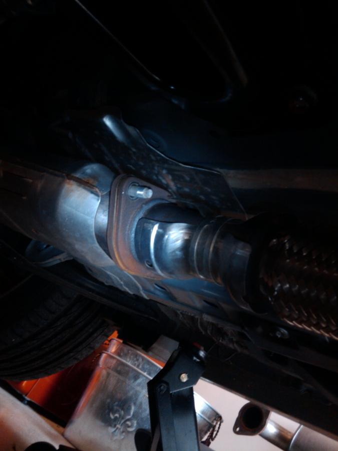 One of the Catalytic Converters where it meets the stock NISMO catback. Remove using 14mm deep socket