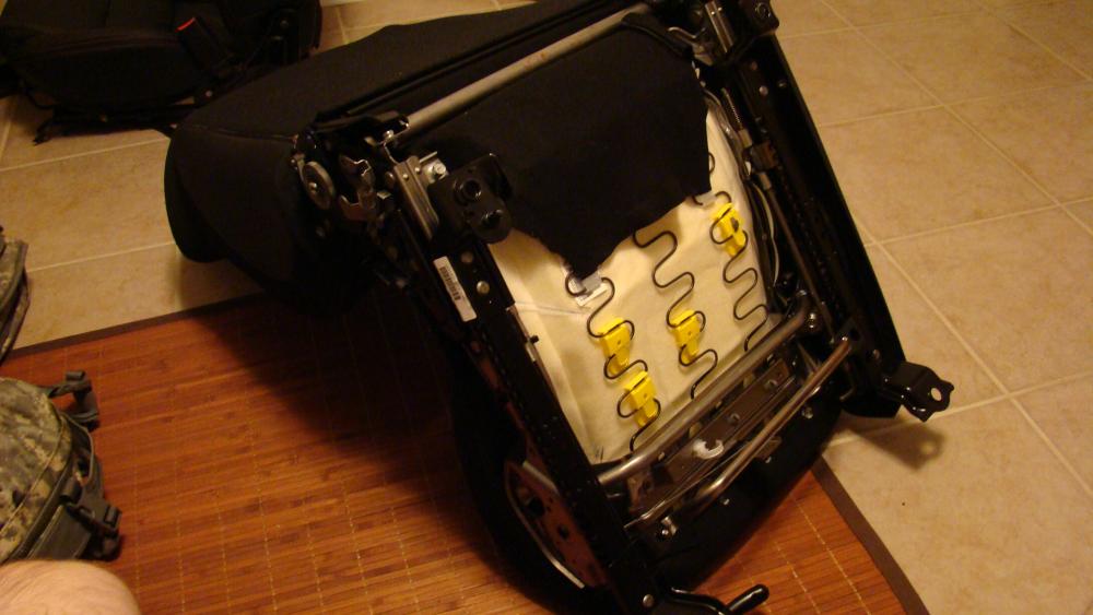 The bottom of the passenger seat. (Note, passenger weight sensor, and SRS airbag system have already been removed, so there are no electrical connectors coming out the bottom in this image)