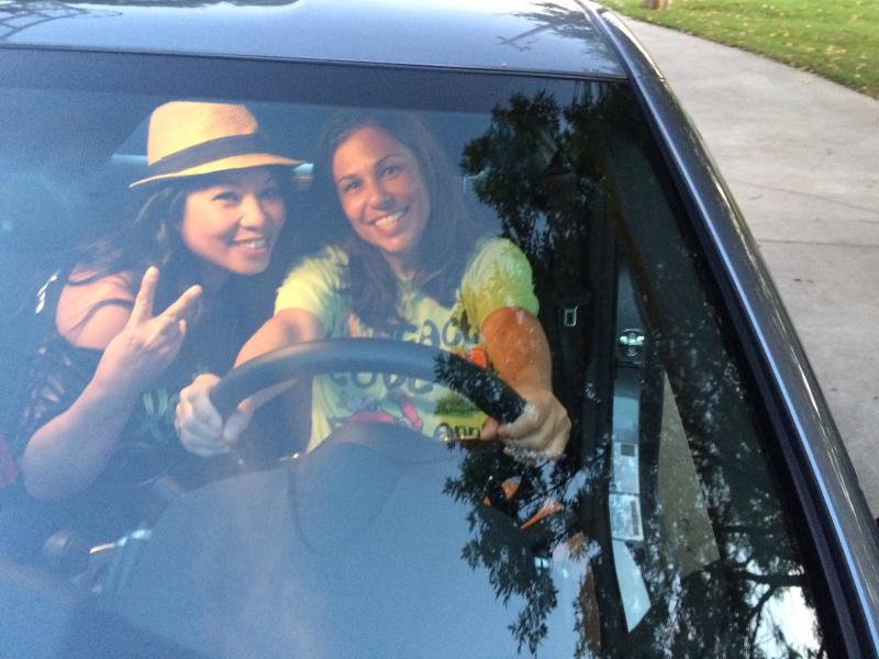 Wife showing a friend my car