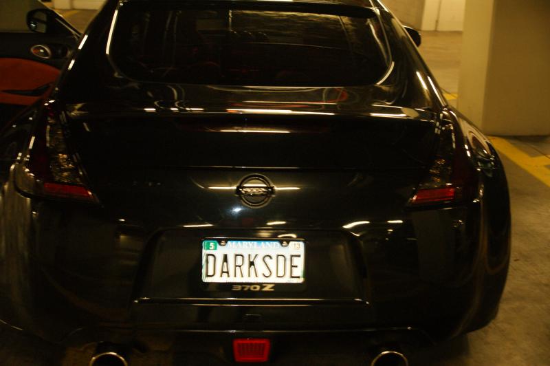 View of the darkened tail lights and emblems