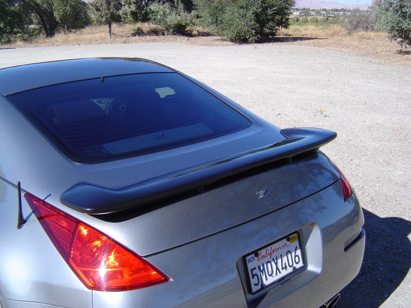 Another shot of debadge, tint and G35 spoiler on my old 350Z. Also note the wiper delete. The car just looks cleaner without the wiper.