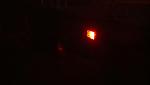 The rear hatch light in red.