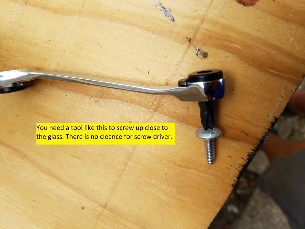 Tool Screw Next To Glass