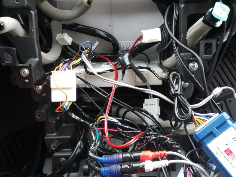 Lots of wires....I hate wires. Notice on the left hand side under the ignition plug in. I think that is where it is grounded. Could this be why I am still hearing a bit of white noise when the unit is on?