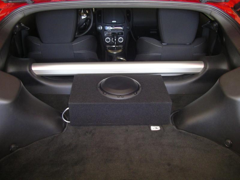JL Audio CP108LG-W3v3 8" Sub, connected to JL Audio Slash 250 1v2 mono block amp (250 RMS).  HU is Alpine CDA9886 (18 RMS) with Alpine KTP amp (45 RMS) for a total front 63 RMS , also XM mini tuner, Door speakers are Infiniti Ref 6022i.