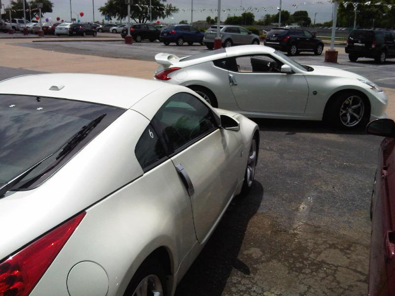 old and new at the car lot
