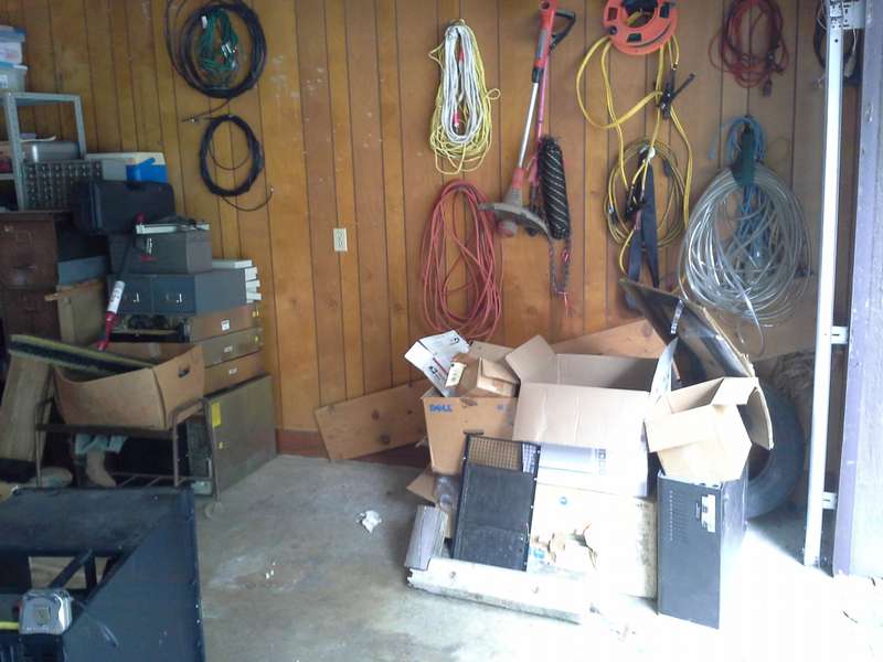 Garage01. Electrical cords, ropes, etc. To the left, under the index card box, are 7 or 8 power supplies from the mainframe. That's all junk on the right.