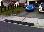 Bridjit rolling curb ramps. 
 
http://www.bridjit.com