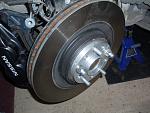 replace rotor and tighten into place with nuts and washer, replace brake assembly