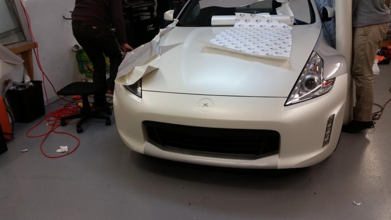 Satin pearl white 3M vinyl wrap (w/gloss black roof, rear diffuser, spoiler & satin black lower-center front bumper)