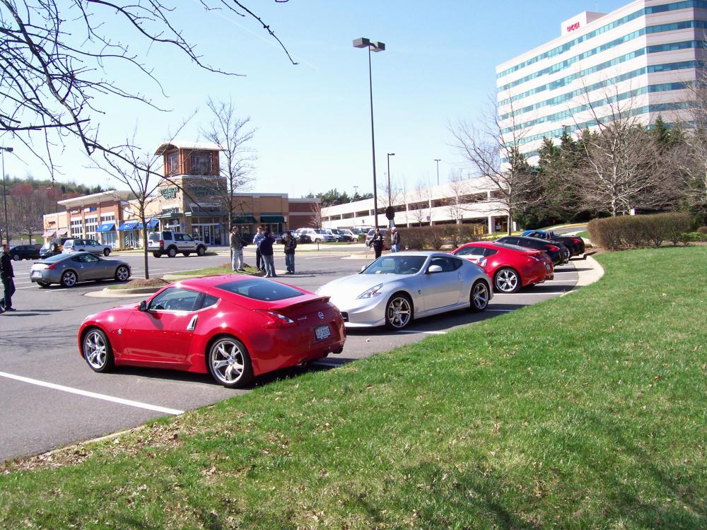 From the rear a Red 370Z in front belonging to Ross with Omar's NISMO and bracketed by Steve's Red 370Z.