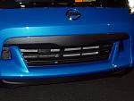 The black lip along the bottom is nice, but the black piece above central air intake is curious.  I think it might look better (less intrusive) in...