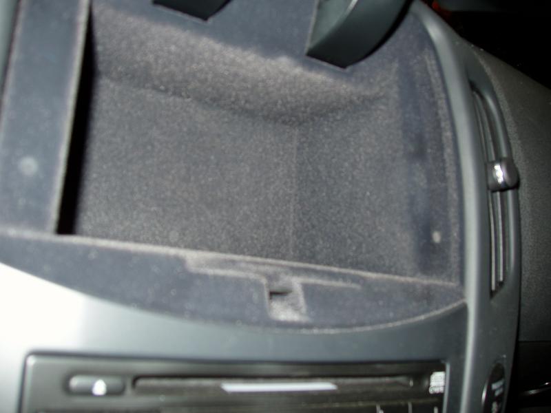 Central storage bin in cars without navigation.