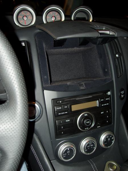 Central storage bin door no longer disappears into the dash.  It just sticks out straight and in the way.  Makes installation of a portable GPS here a little less likely.